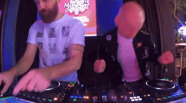two men are playing music in front of a sign that says misfits summer party