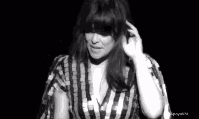 a black and white photo of a woman with long hair