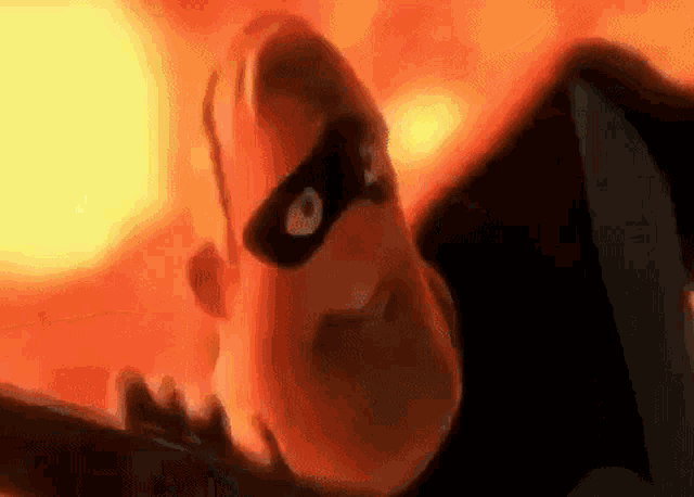 a cartoon character from the movie the incredibles is wearing a mask and looking at the camera .