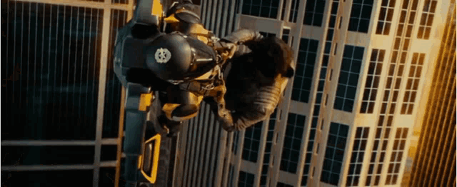 a person is flying through the air while wearing a helmet with the number 83 on it .
