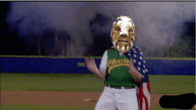 a baseball player wearing a mask with the word oakland on his jersey