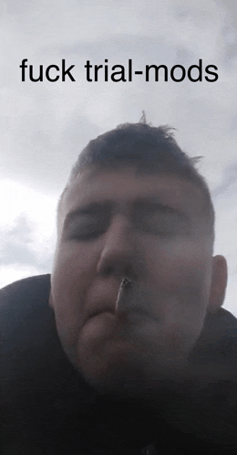 a man smoking a cigarette with the words " fuck trial-mods " on the bottom
