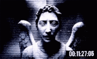 a black and white photo of a statue with wings and the time 00 : 11 : 27 : 06 on the bottom