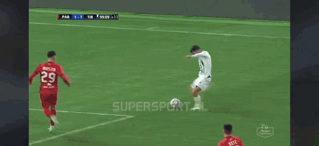 a soccer game is being played on a supersport.al advertisement
