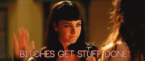 a woman says " bitches get stuff done " in front of a mirror