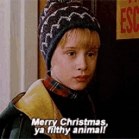 a young boy says merry christmas ya filthy animal in front of a sign that says escape