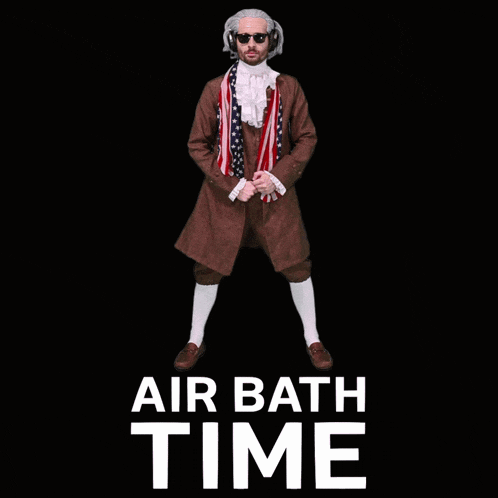 a man in a brown suit is standing in front of a black background with air bath time written on it