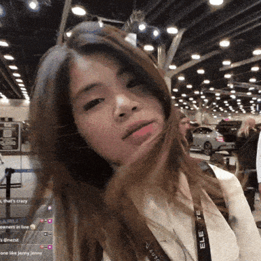 a woman wearing a lanyard that says elevate