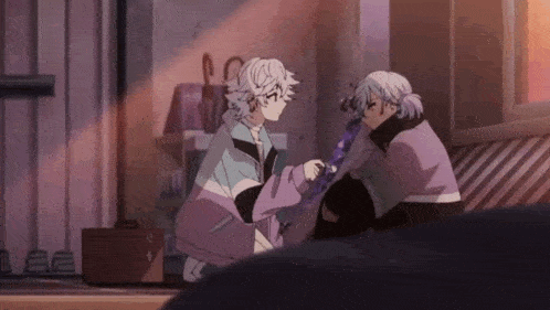 a couple of anime characters are sitting next to each other in a room holding hands .