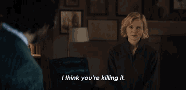 a woman says i think you 're killing it in a dark room