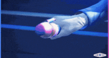a close up of a person holding a microphone in a blue and pink graphic