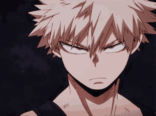 a close up of a person 's face with a serious look on his face