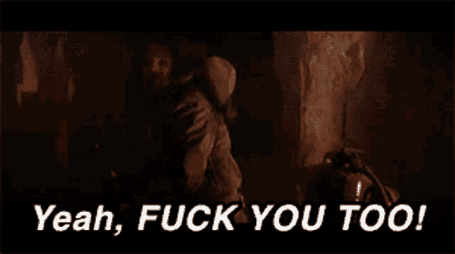 a man in a cave is saying yeah fuck you too .