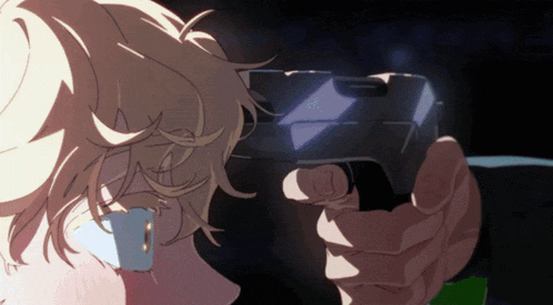 a close up of a person holding a gun in a dark room