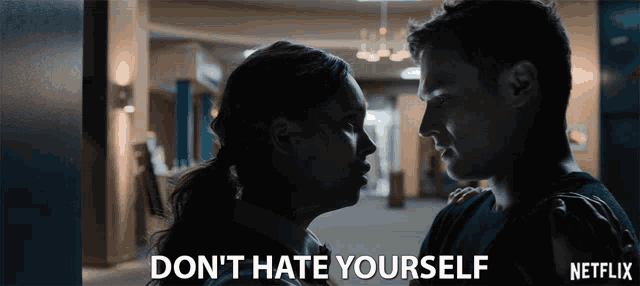a man and a woman are looking at each other with the words " do n't hate yourself " above them