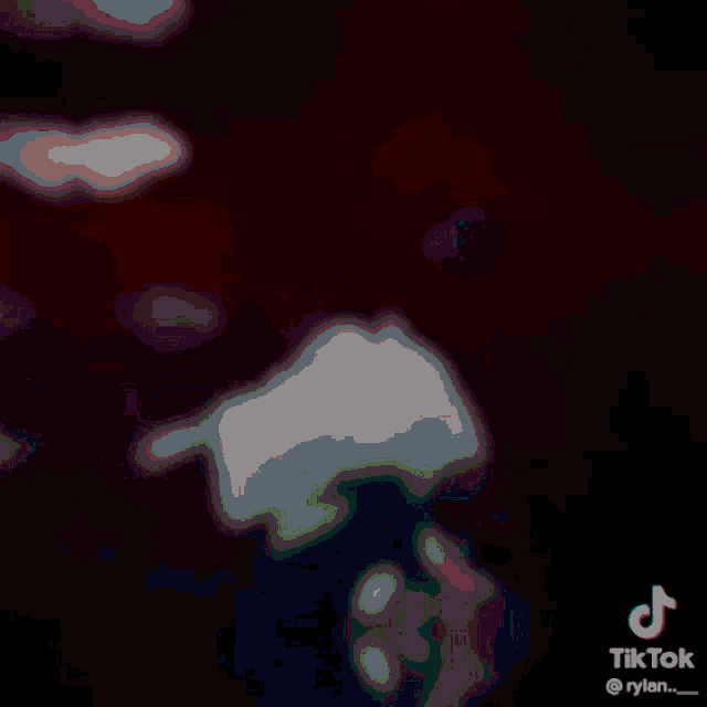a tiktok video shows a shadow of a person on a yellow wall