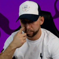 a man with a beard wearing a white shirt and a hat with a purple background