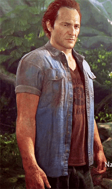 a man wearing a denim shirt and a brown t-shirt with the word army on the front