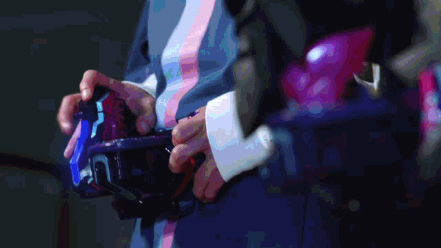 a blurry picture of a person holding a blue object with the letter p on it