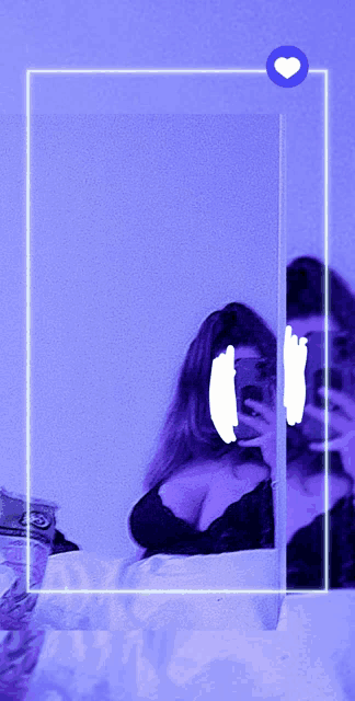 a woman taking a picture of herself in the mirror