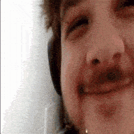 a close up of a person 's face with a headphone on