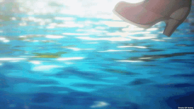 a woman in high heels is walking through the water