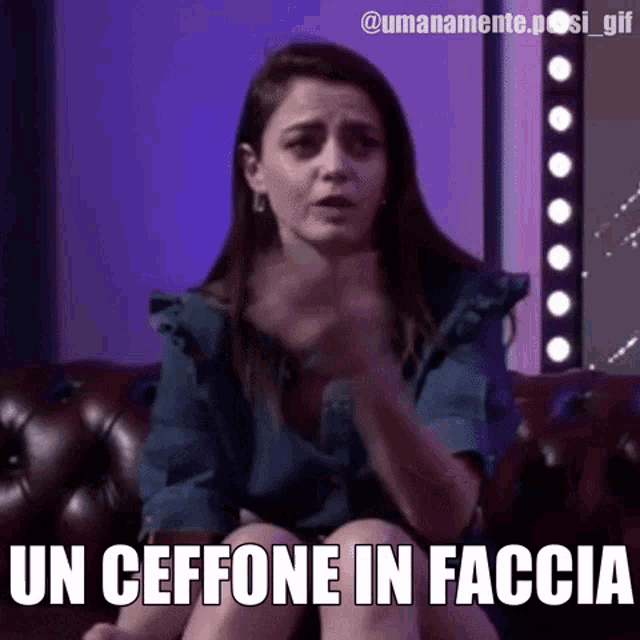 a woman is sitting on a couch with the words un ceffone in faccia written on the bottom