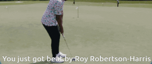a man on a golf course with the words " you just got beat by roy robertson-harris " below him