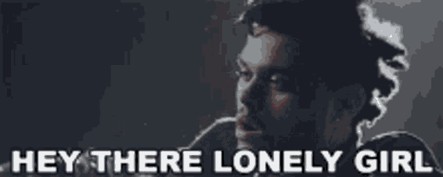 a man with a beard says hey there lonely girl while smoking a cigarette