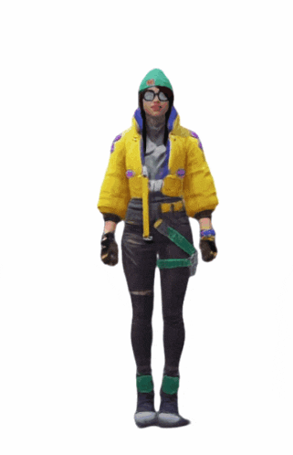 a woman in a yellow jacket and green hat is standing with her arms outstretched