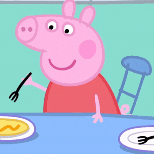 a cartoon pig is sitting at a table eating a piece of food on a fork