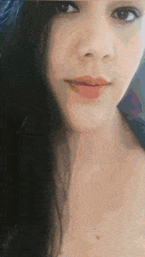 a close up of a woman 's face with a pink lip