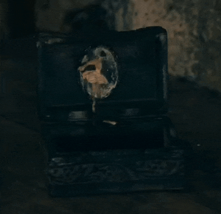 a black box with a key in it is open