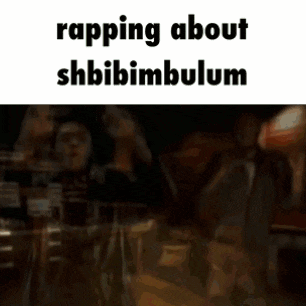 a man in a black jacket is rapping about shbibimbulum with his hands in the air .