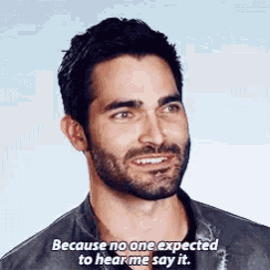 a man with a beard is smiling and says because no one expected to hear me say it