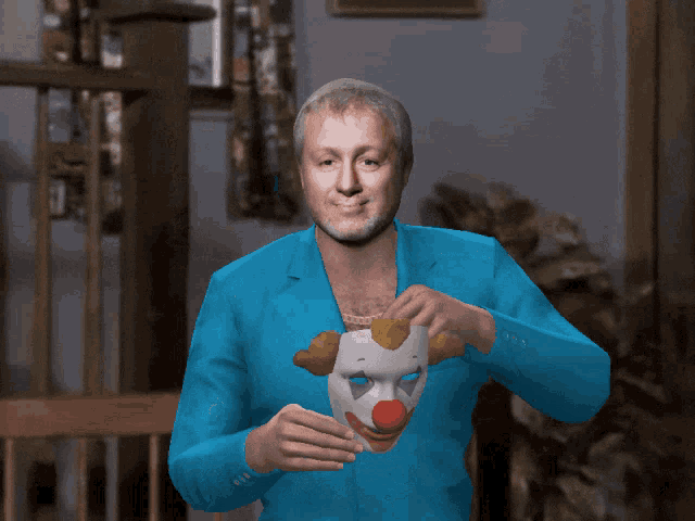 a man in a blue suit holding a clown mask