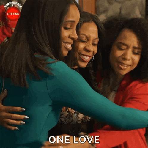 three women hugging each other with the words one love written below them
