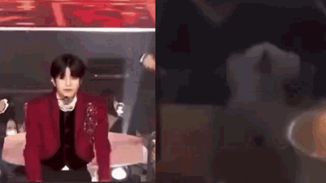 a man in a red jacket is dancing on a stage next to a picture of a tooth .