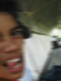 a blurry picture of a woman 's face with a blurred background