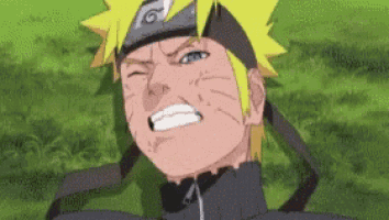 a close up of a naruto character laying on the grass with his eyes closed .