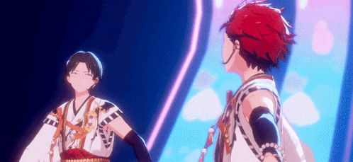 a couple of anime characters are standing next to each other on a stage and dancing .