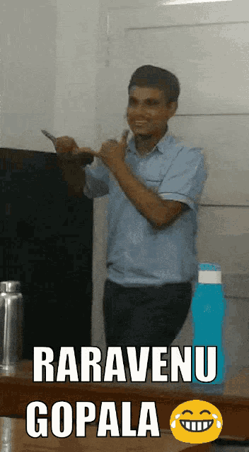 a man giving a thumbs up next to a sign that says " raravenu gopala "