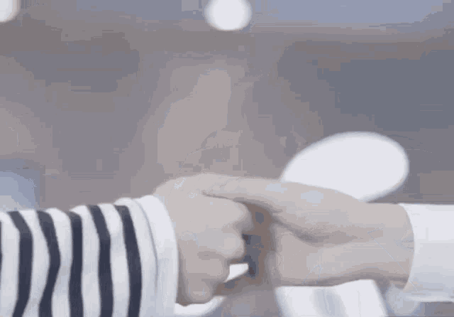 a close up of two people 's hands holding each other 's fingers