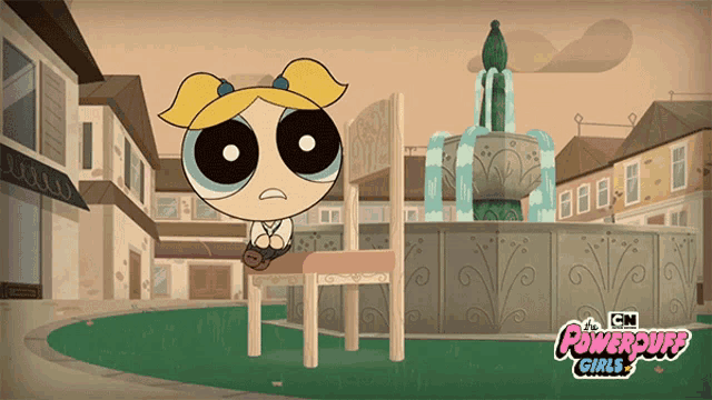bubbles from the powerpuff girls sits at a table