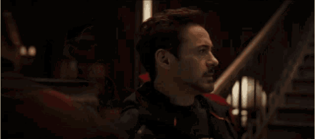 doctor strange and tony stark are walking down stairs