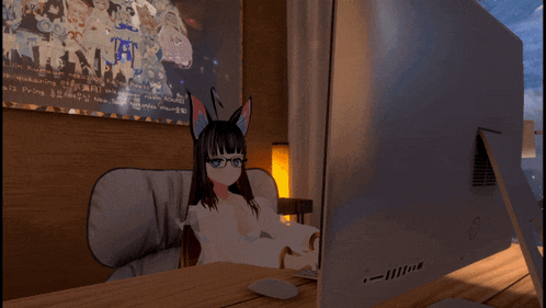a computer monitor with a picture of a girl in front of it and a sign on the wall that says " i love you "