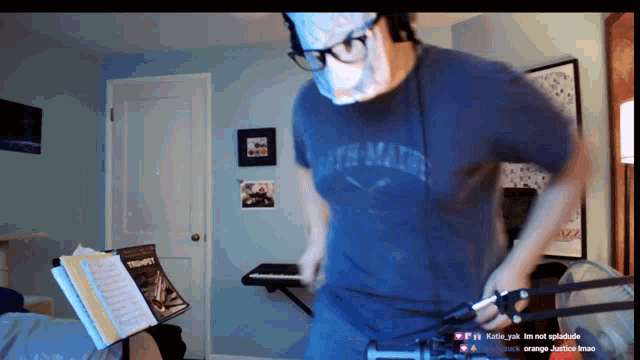 a man wearing a mask and a shirt that says beth math on it
