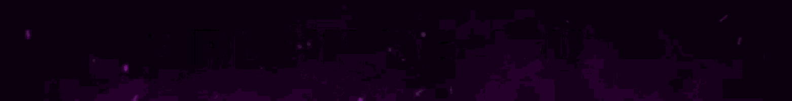 a purple light beam is coming out of a hole in a dark background .