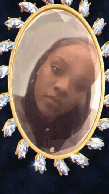 a picture of a woman in an oval frame with diamonds