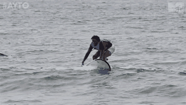 a man is riding a surfboard in the ocean with the hashtag #ayo